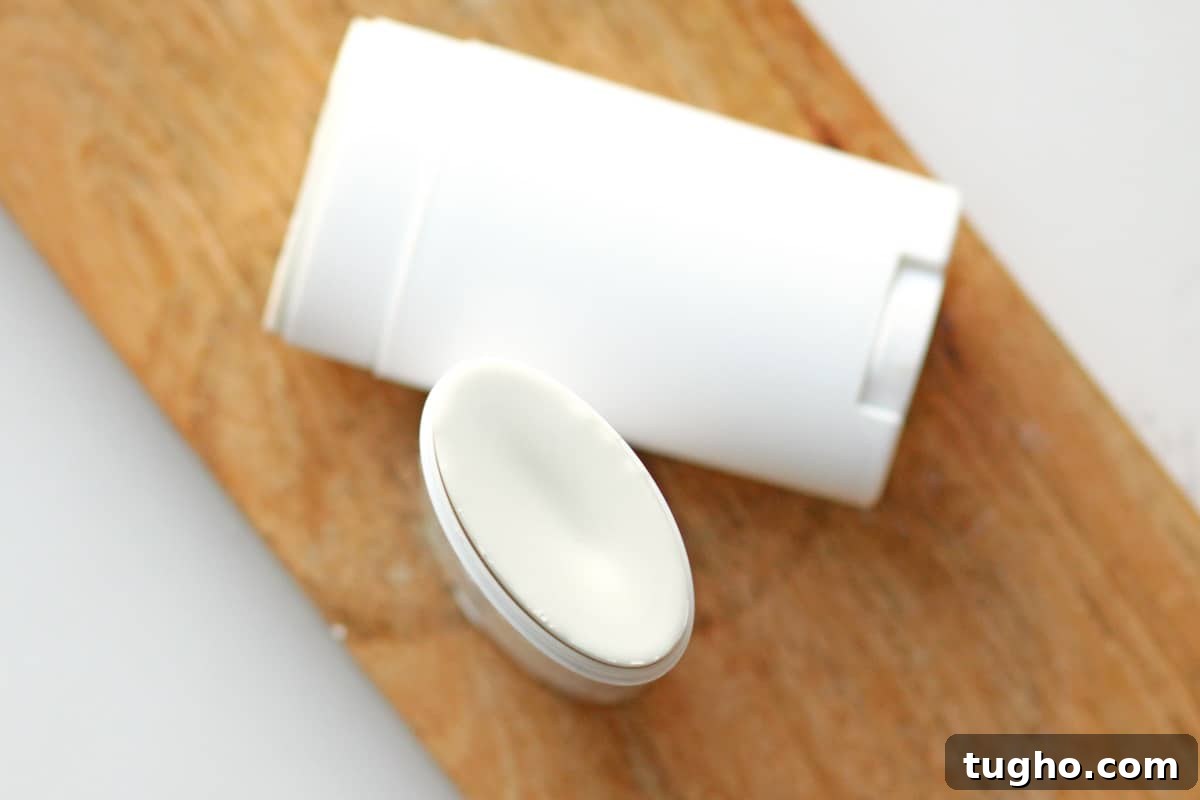 two unused tubes of homemade deodorant laying on a countertop
