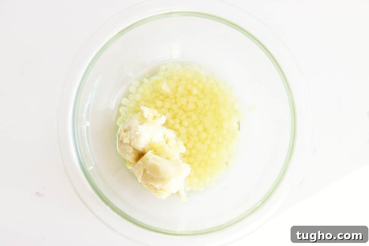 a bowl of shea butter, beeswax pellets and coconut oil 
