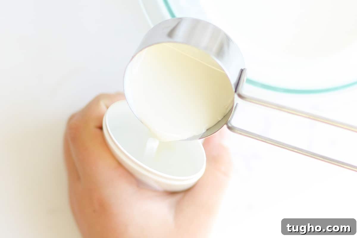 liquid deodorant being poured into an empty deodorant tube