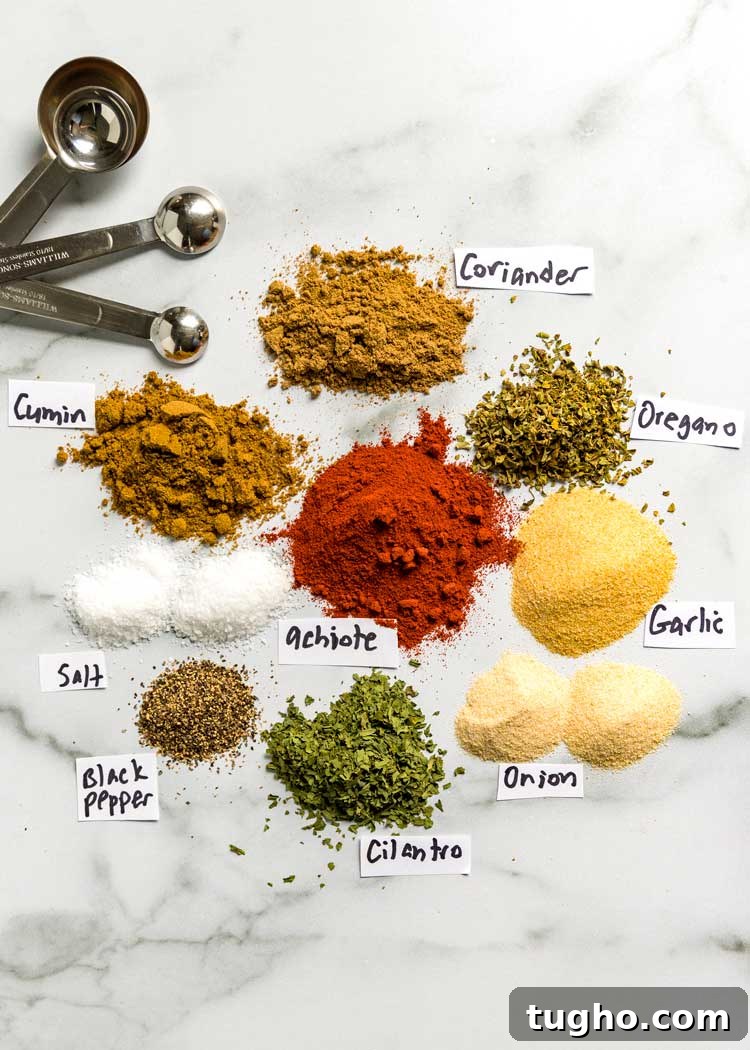 How to Make Authentic Sazon Seasoning 3 overhead: counter with small piles of spices needed for sazon seasoning