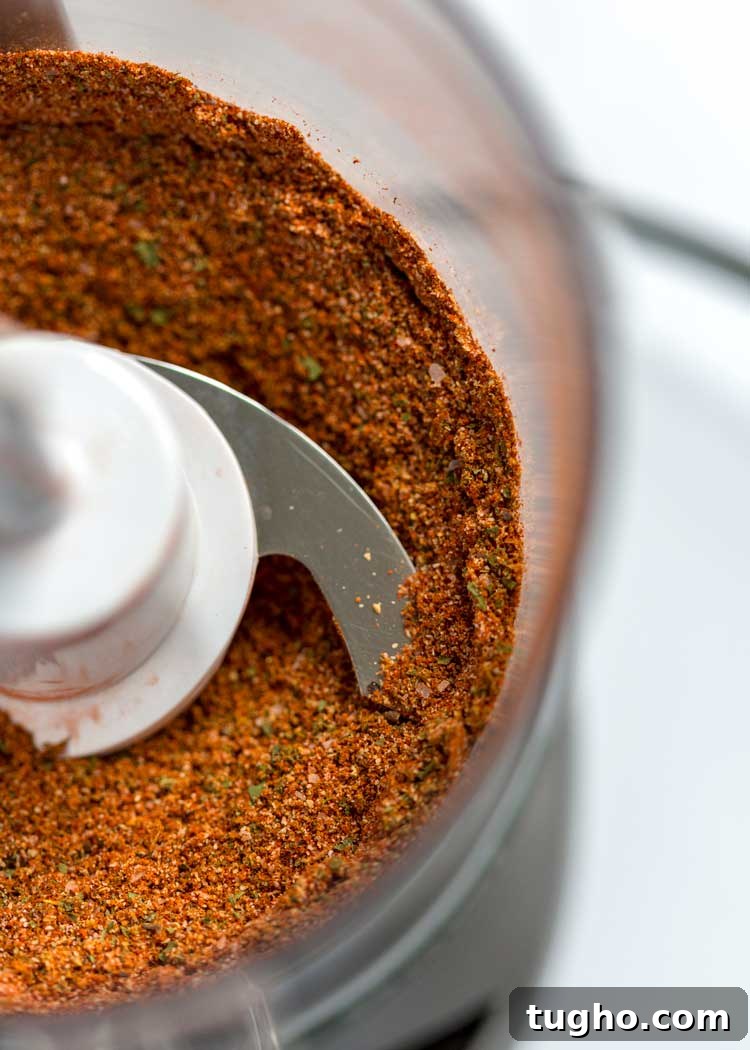 How to Make Authentic Sazon Seasoning 4 closeup: spices for my sazon seasoning recipe in food processor bowl