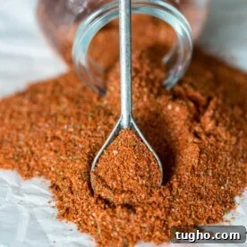 Close up of sazon seasoning on a spoon