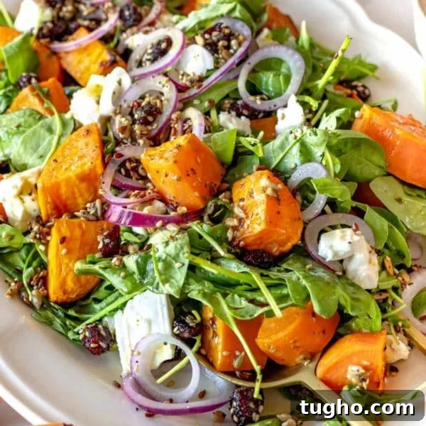sweet potato salad with arugula and feta on a platter