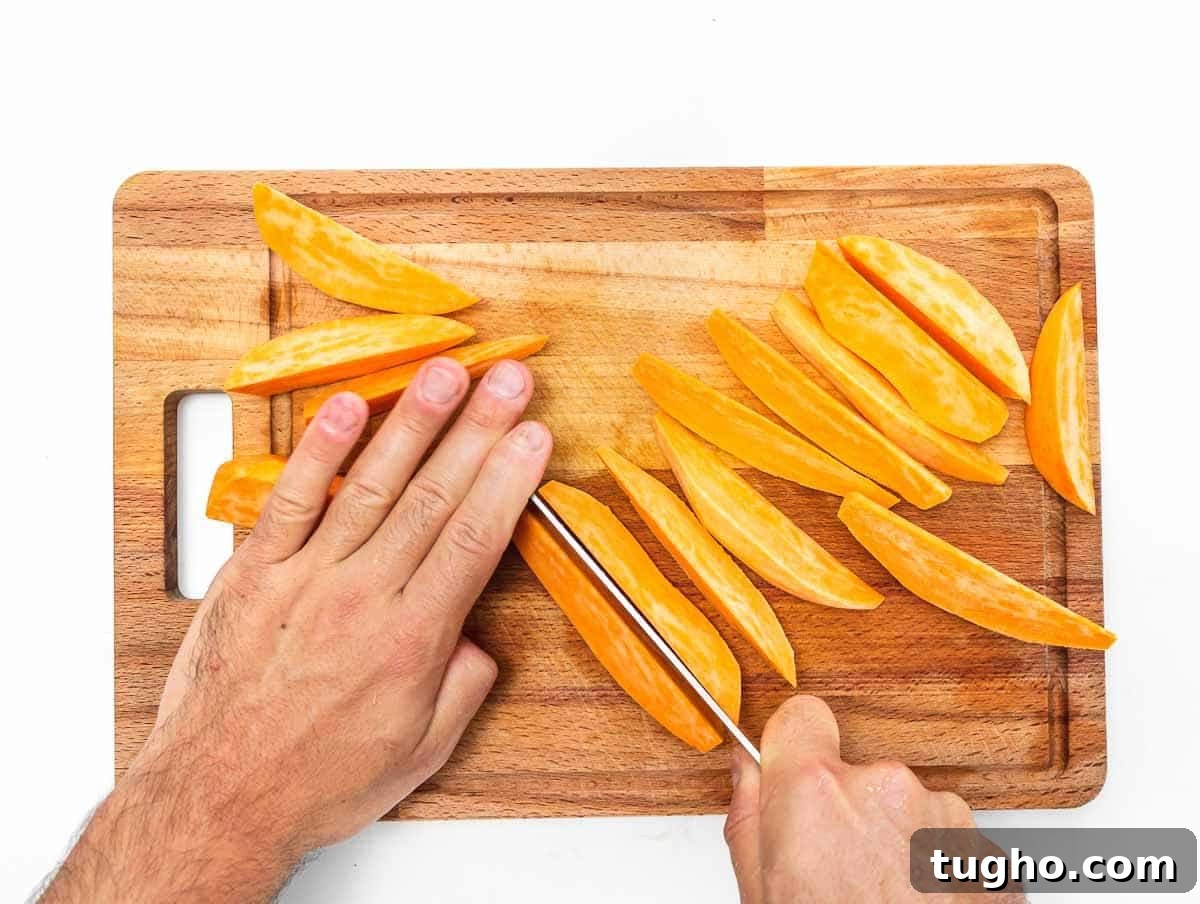 cutting the sweet potatoes into wedges