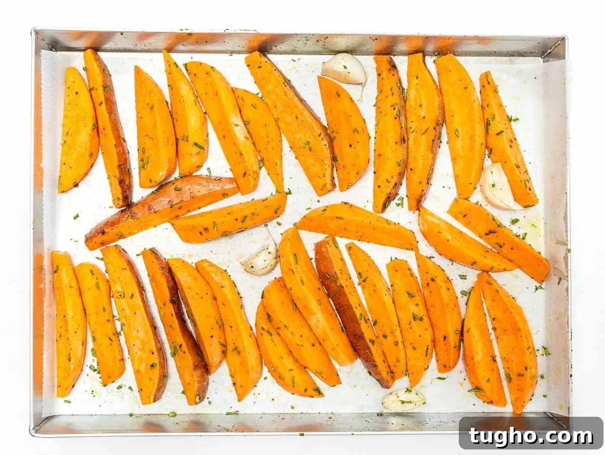 sweet potato wedges arranged on baking sheet