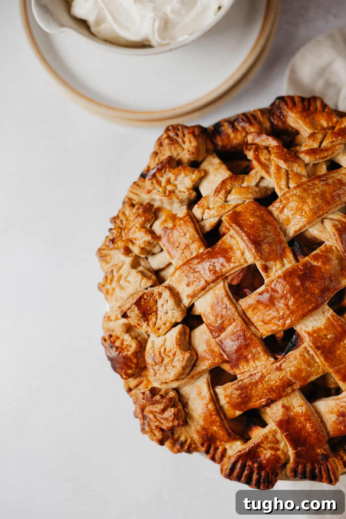 A close up of a pie with a lattice top