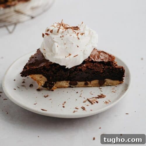 A slice of brownie pie with whipped cream