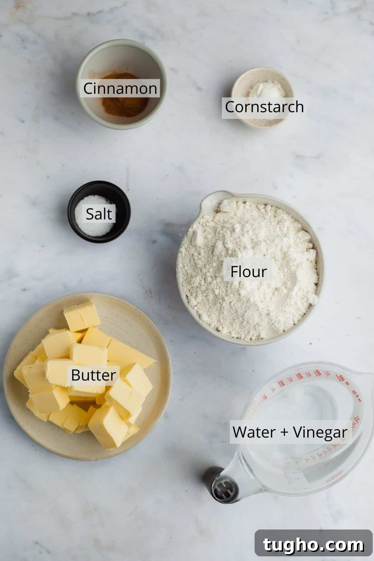 ingredients for cinnamon pie dough in an variety of small bowls and jugs