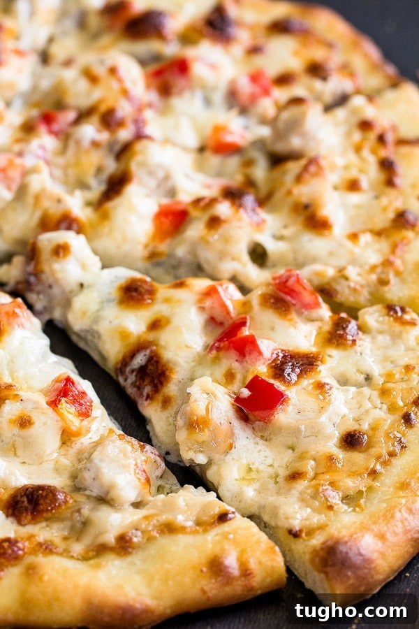 Creamy Chicken Alfredo Pizza Recipe 5 Tips and tricks for delicious thin crust pizza with creamy cheesy chicken alfredo topping.