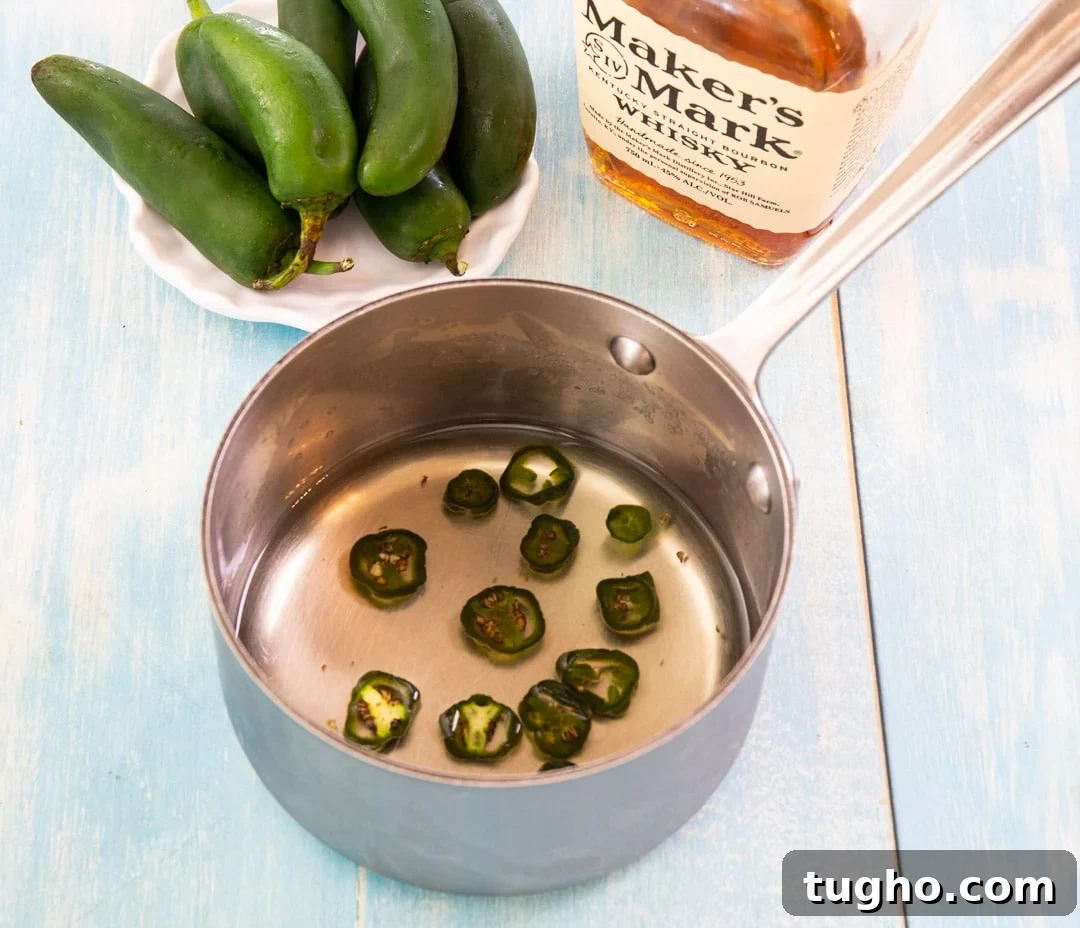 Jalapeno simple syrup in a saucepan.