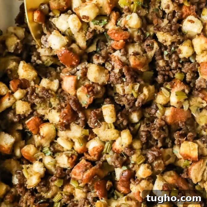 Close-up view of sausage stuffing in a casserole dish.
