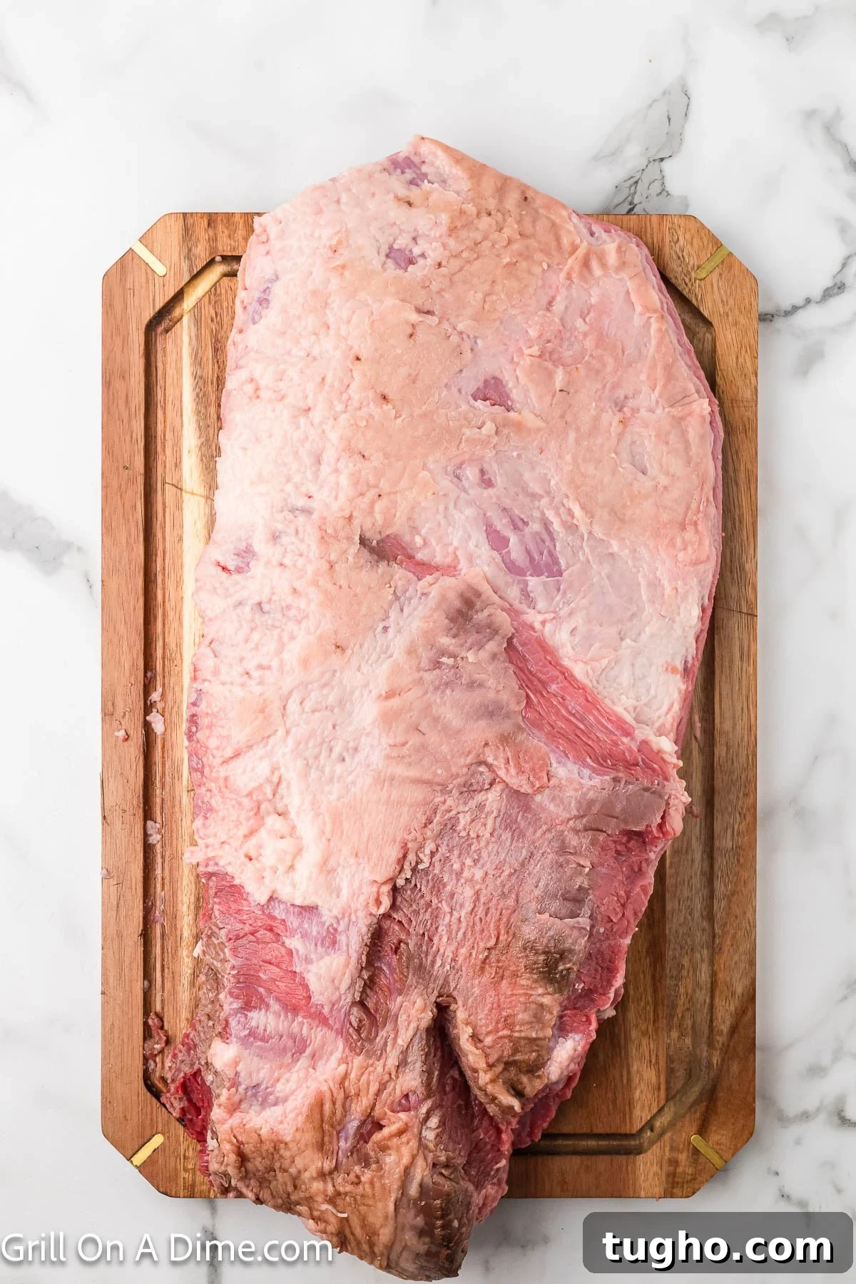 Authentic Texas Style Brisket Recipe 4 Raw brisket on a cutting board