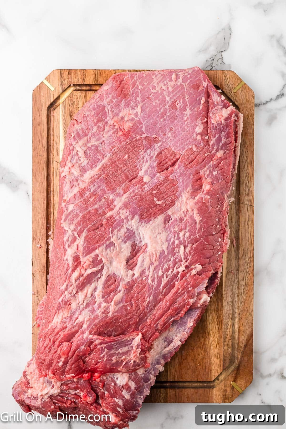 Authentic Texas Style Brisket Recipe 5 Trimmed brisket on a cutting board
