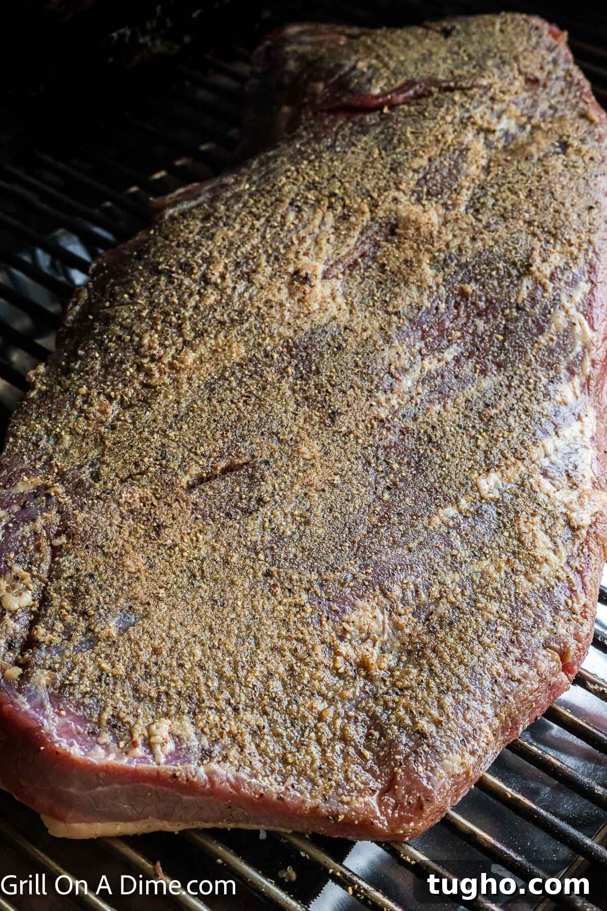 Authentic Texas Style Brisket Recipe 8 Placing the seasoned brisket on the grill grates