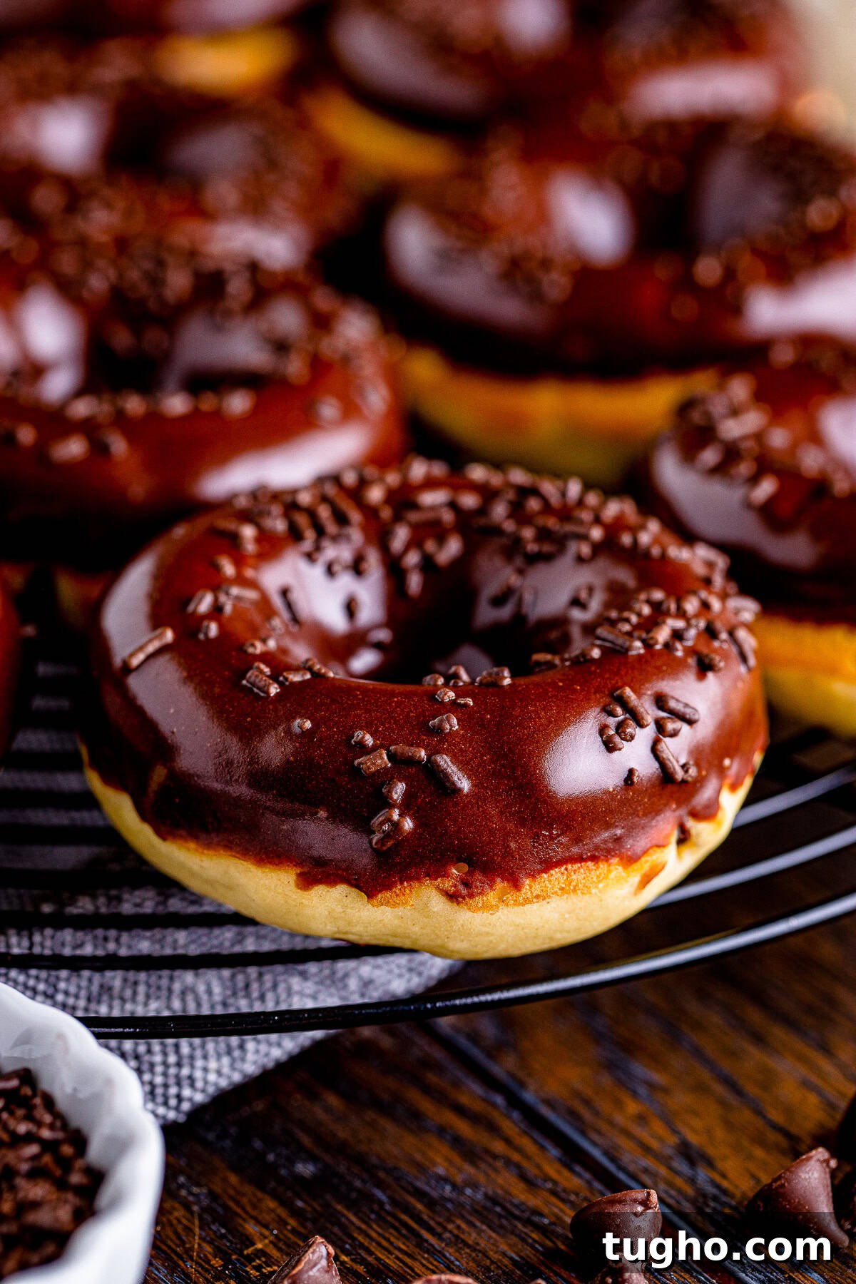 Fluffy Baked Chocolate Chip Cake Donuts Recipe 6 up close image of Cake Donuts on wire rack