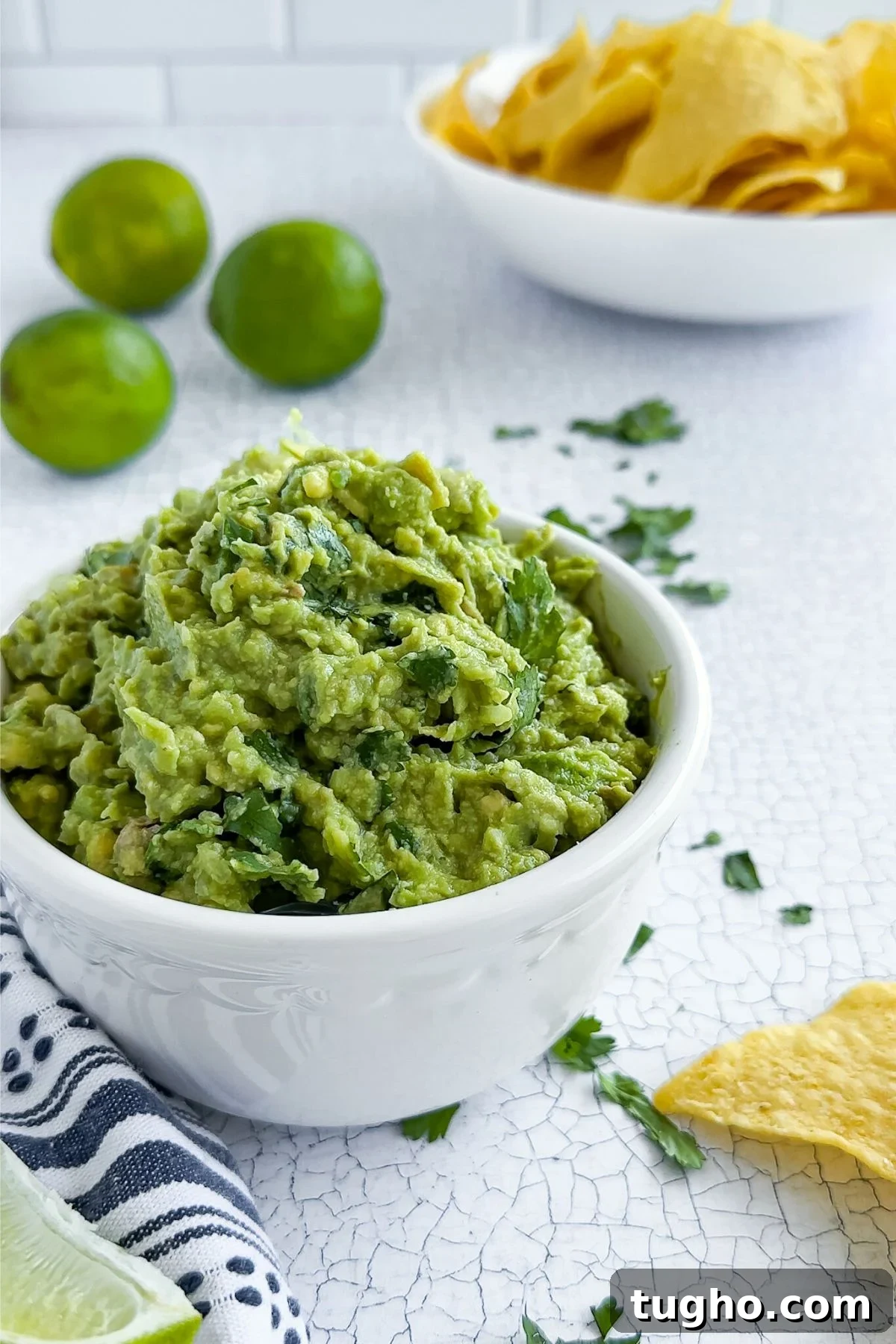How to Make Authentic Mexican Guacamole with Lime and Cilantro 2 Guacamole in a bowl.