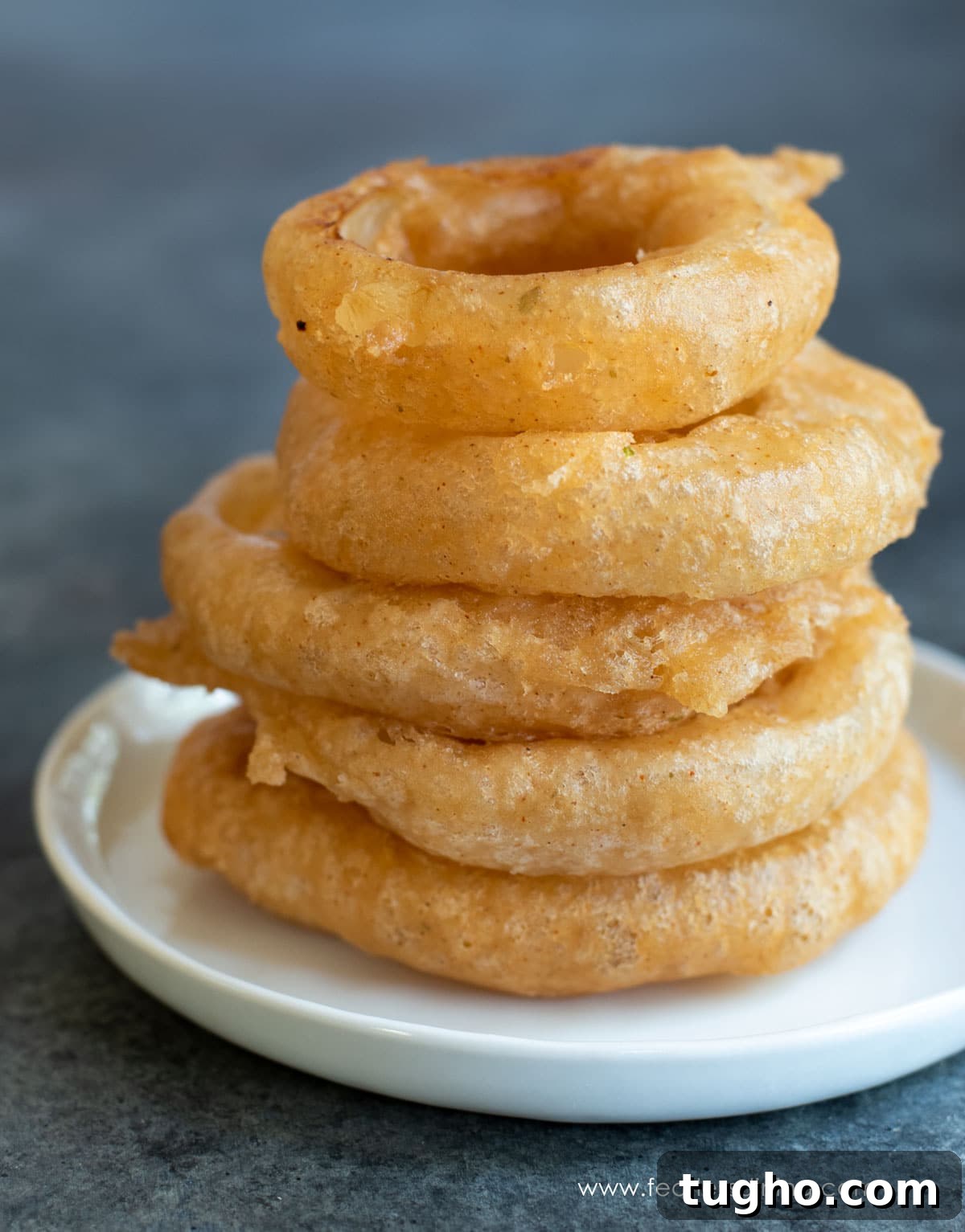 12 Sides That Pair Perfectly with Sloppy Joes 15 A stack of six large gluten free onion rings.