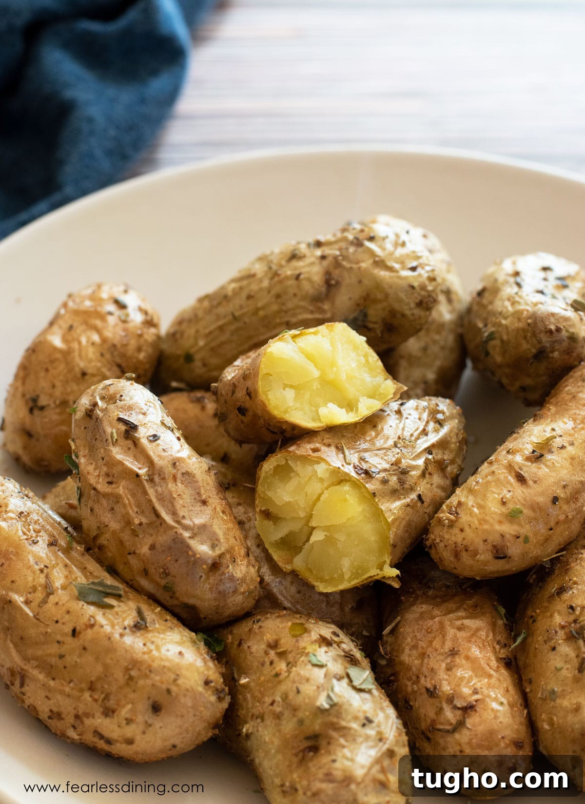 12 Sides That Pair Perfectly with Sloppy Joes 9 A bowl full of roasted air fryer fingerlings potatoes.