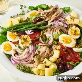 Colorful Nicoise Salad with asparagus and eggs.