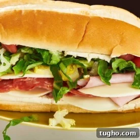 Grinder Sandwich on a gold-colored plate.