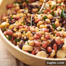 Bean salad in brown serving bowl.