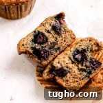 Banana blueberry muffin on parchment paper.