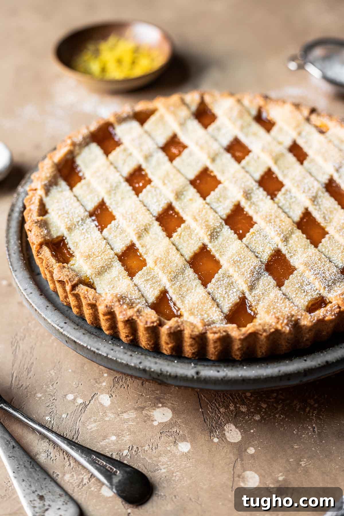 Classic Italian Jam Crostata Recipe 13 A lattice topped crostata di marmellata on a plate.