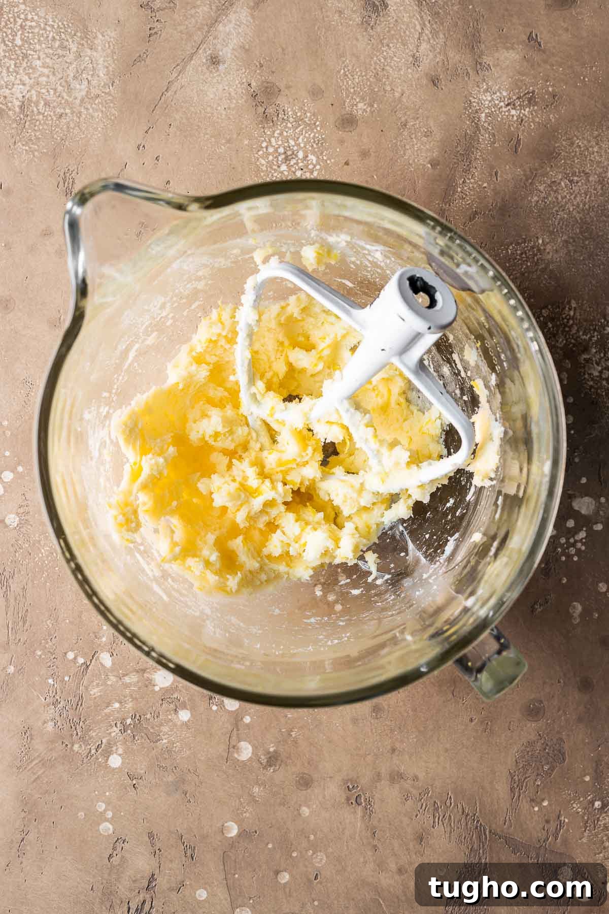 Classic Italian Jam Crostata Recipe 4 Wet ingredients for pastry dough in a clear glass mixing bowl.