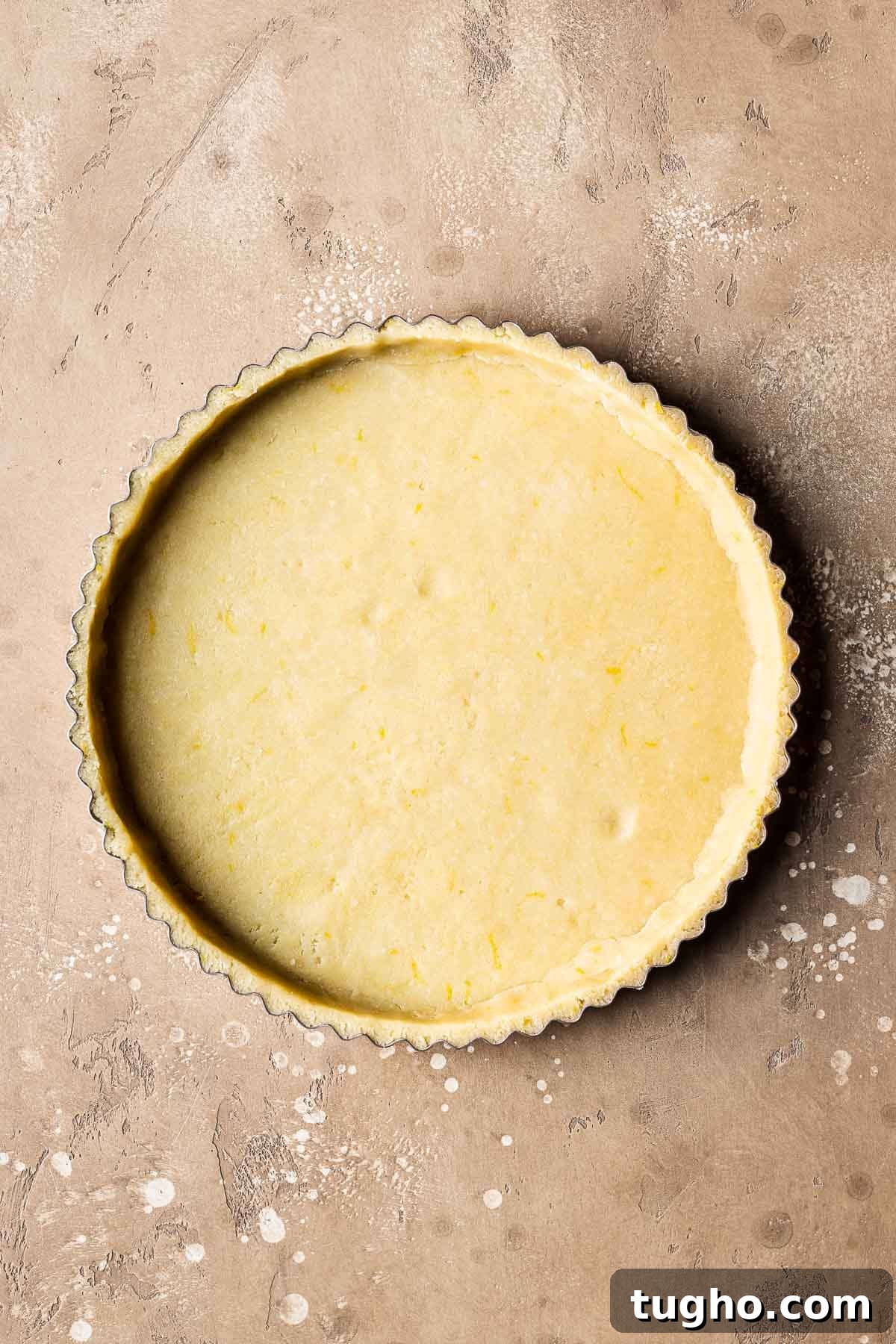 Classic Italian Jam Crostata Recipe 9 Unbaked pastry dough in a fluted tart pan.