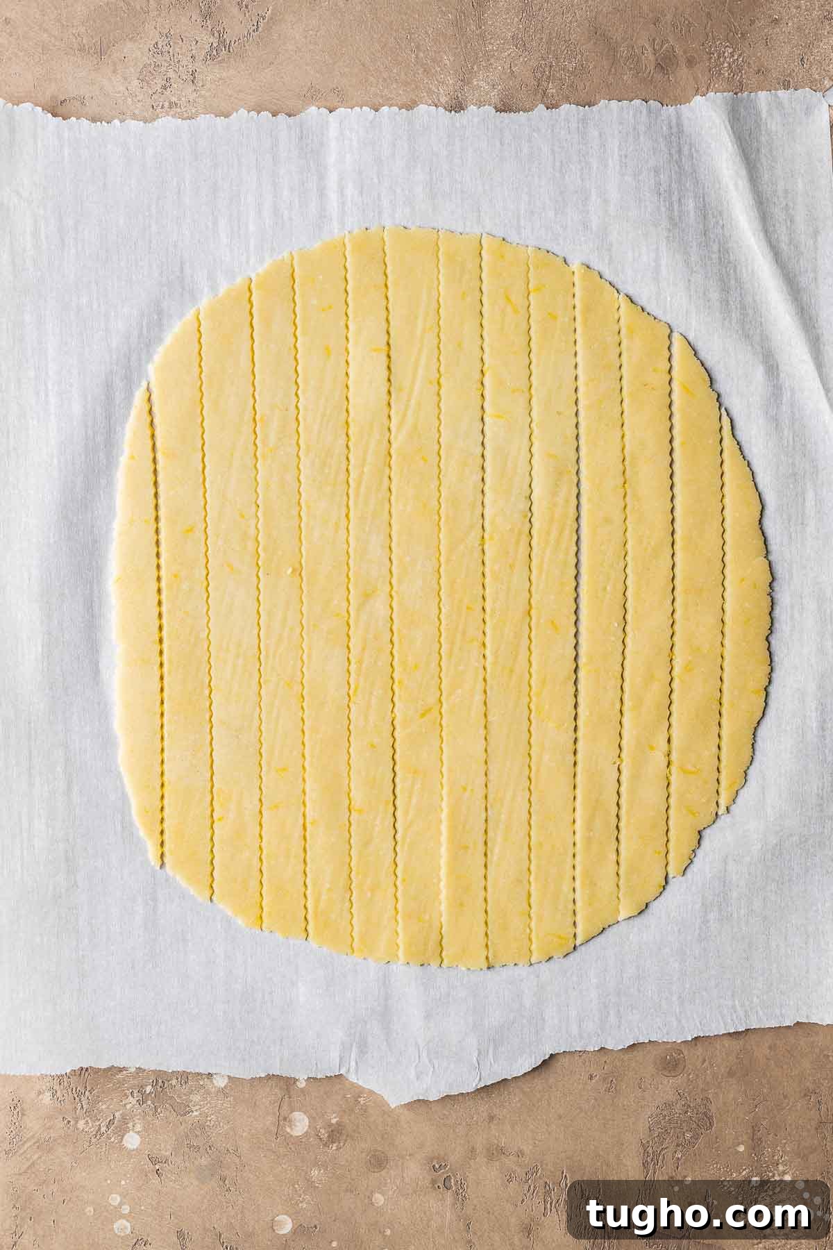 Classic Italian Jam Crostata Recipe 10 Lattice dough strips on white parchment paper.