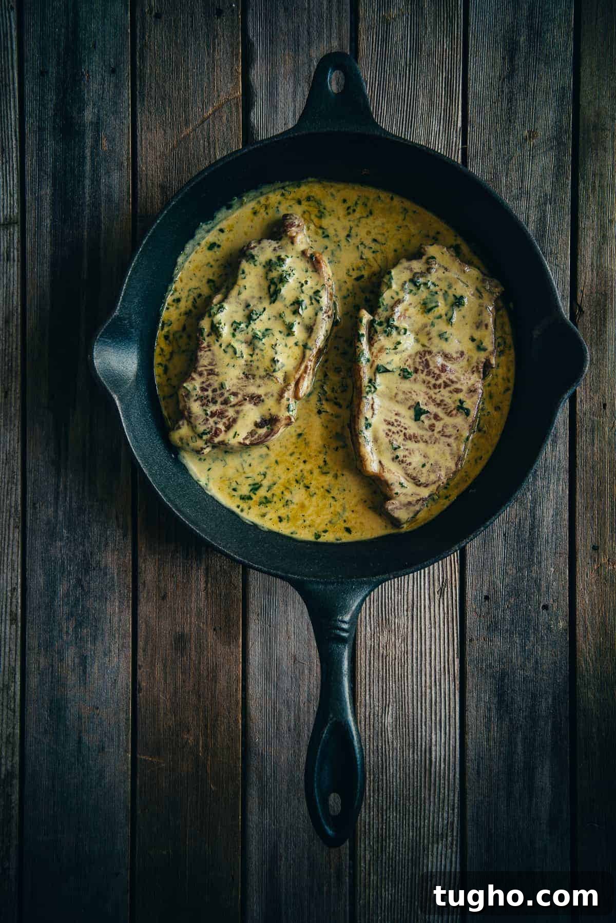steak Diane cooked in a frying pan