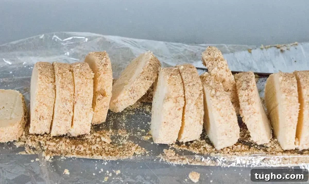 How to Make Slice-and-Bake Cheesecake Cookies 8 A loaf of Slice and Bake Cheesecake Cookies sliced and ready to bake