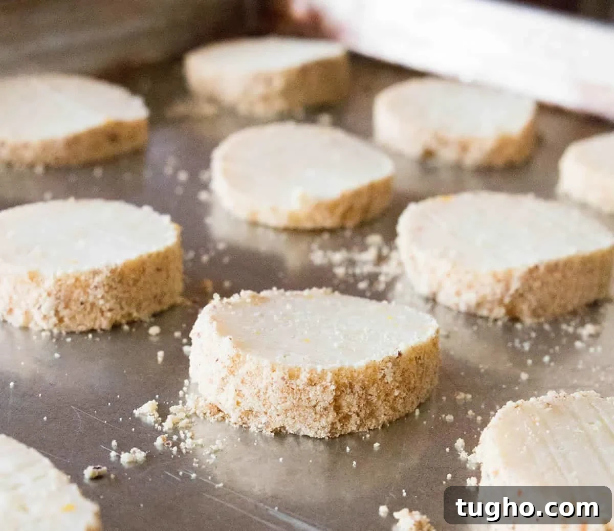 How to Make Slice-and-Bake Cheesecake Cookies 9 Sliced Slice and Bake Cheesecake Cookies on a baking sheet ready to bake