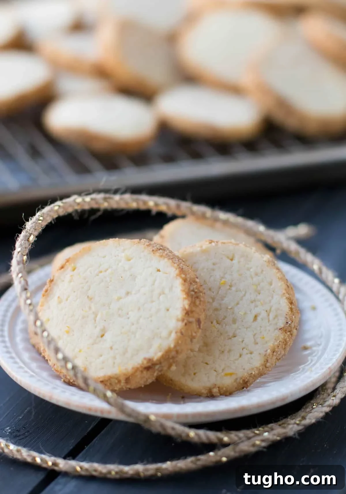How to Make Slice-and-Bake Cheesecake Cookies 10 Slice and Bake Cheesecake Cookies on a white dish with string