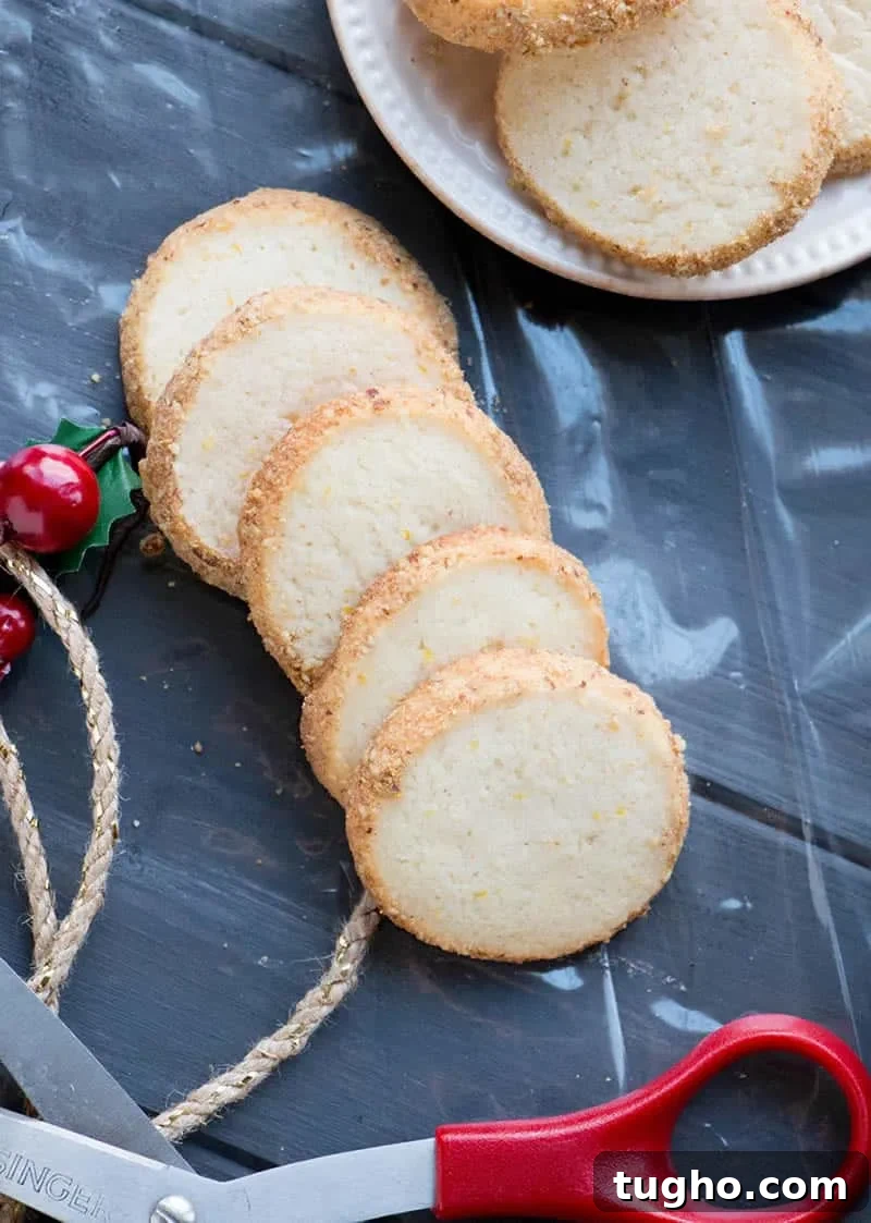 How to Make Slice-and-Bake Cheesecake Cookies 3 Slice and Bake Cheesecake Cookies spread on cello-fain with scissors and rope