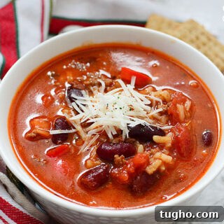 Instant Pot Stuffed Pepper Soup in White Bowl Topped with Cheese