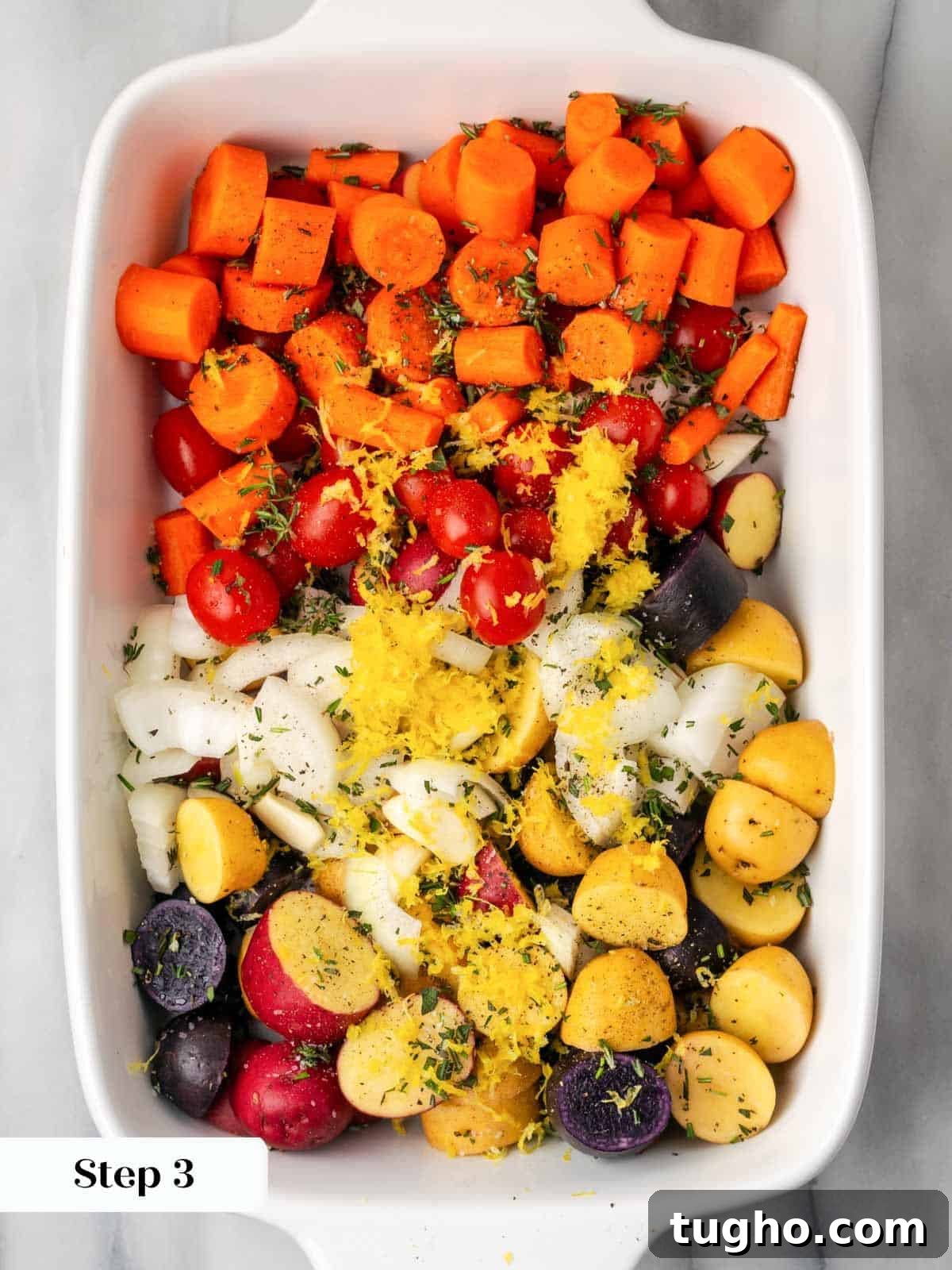 Crispy Oven Roasted Lemon Chicken with Garlic and Herbs 6 vegetables sliced in white baking dish.