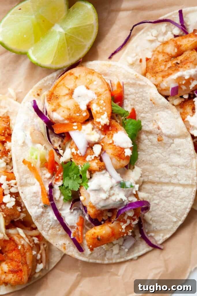 Crispy Baja-Style Shrimp Tacos with Lime Slaw 6 Baja shrimp tacos with cilantro lime cream drizzled on top