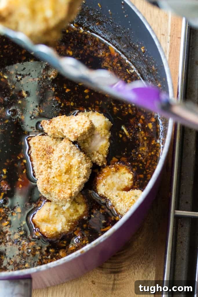 Sticky Sweet and Spicy Chicken Rice Bowls in 30 Minutes 9 Baked chicken added to sticky sauce