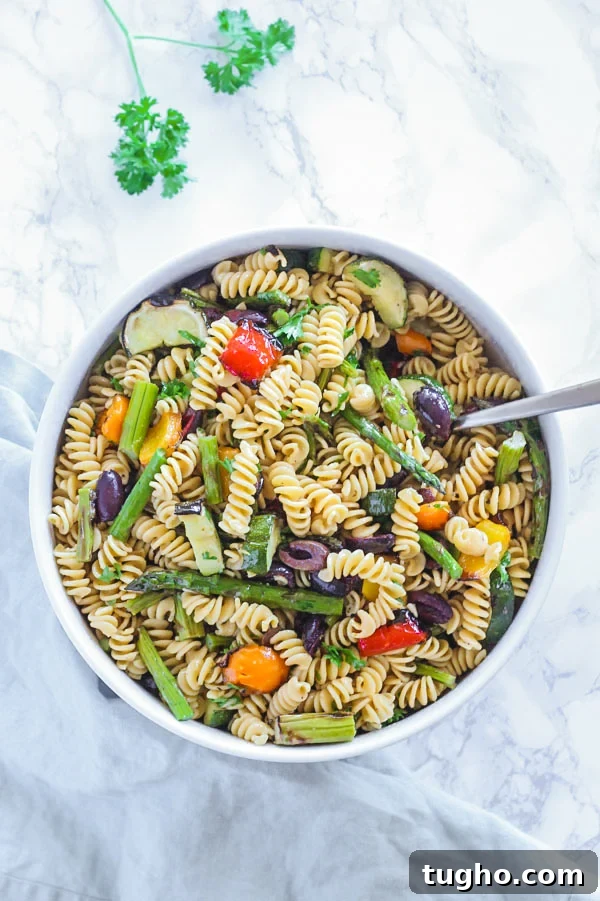 Gluten Free Pasta Salad with Grilled Vegetables 3 grilled vegetable pasta salad in large round serving bowl with spoon