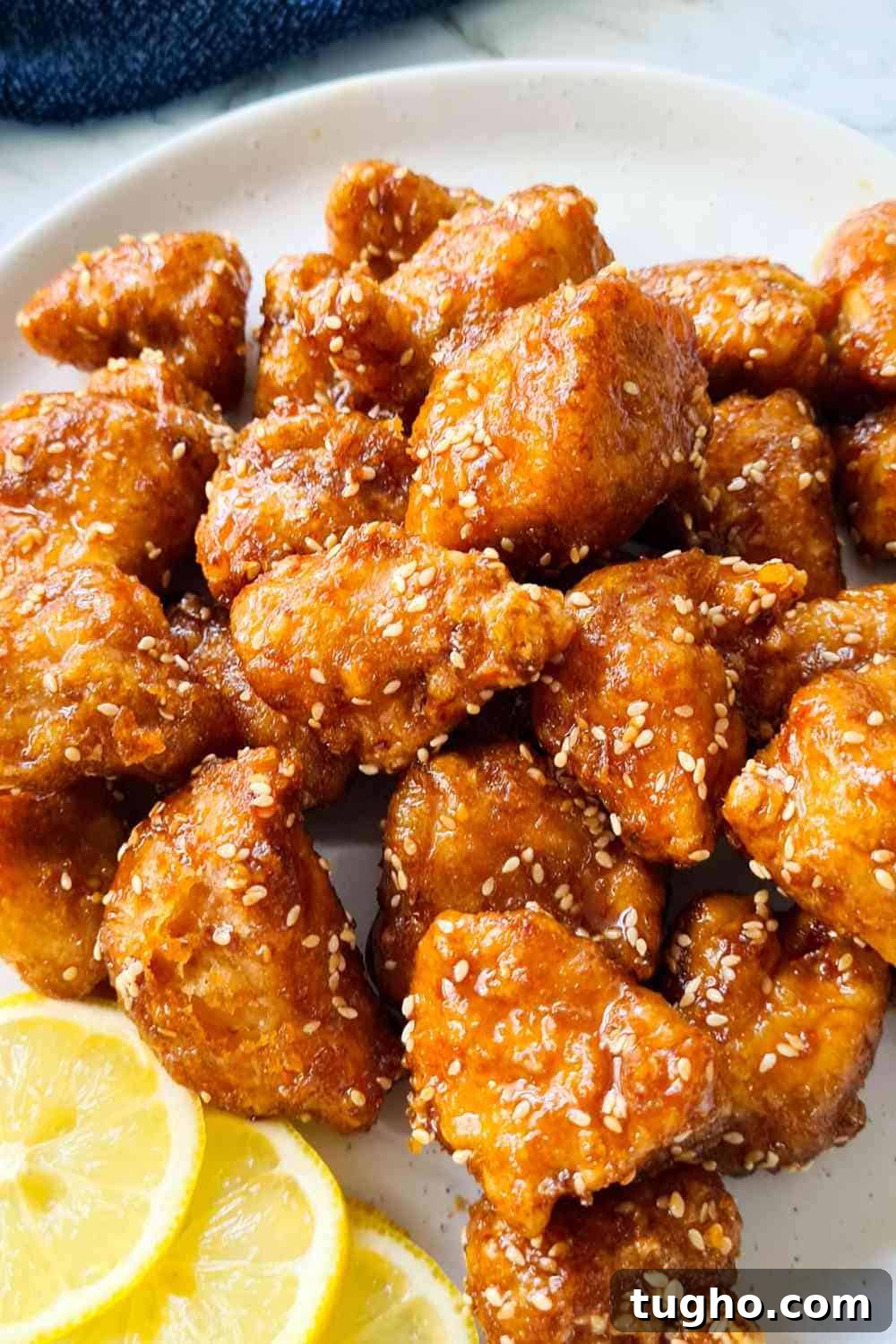 Homemade Crispy Honey Sesame Chicken Recipe 2 A plate of crispy glazed chicken bites
