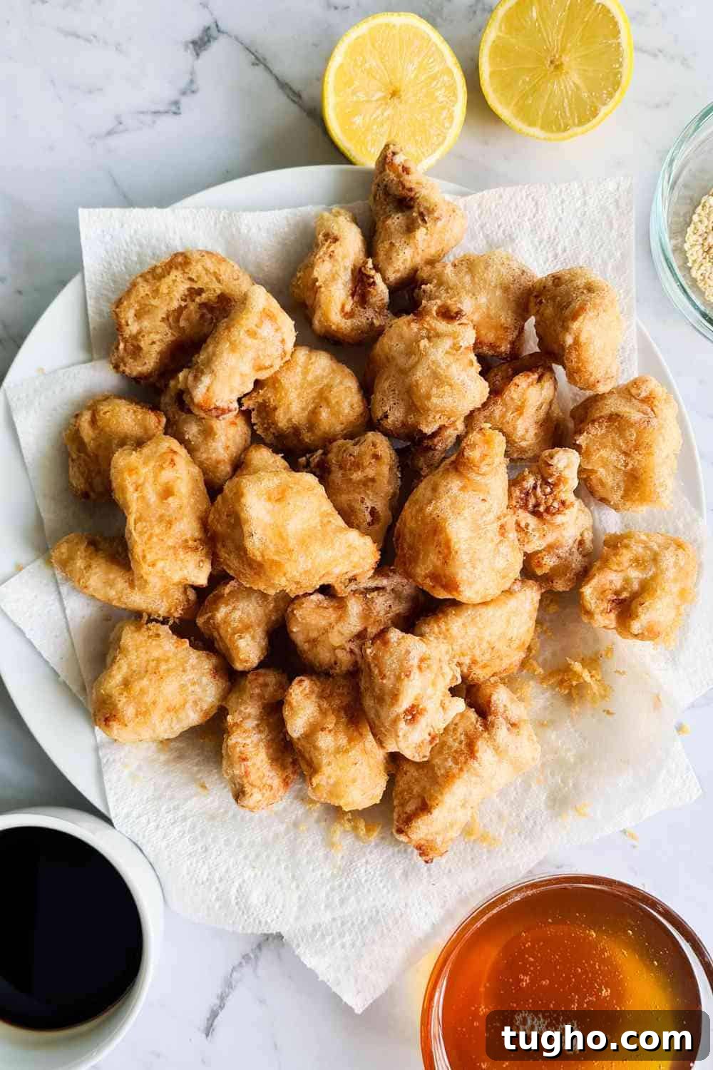 Homemade Crispy Honey Sesame Chicken Recipe 9 A plate of golden crispy chicken bites