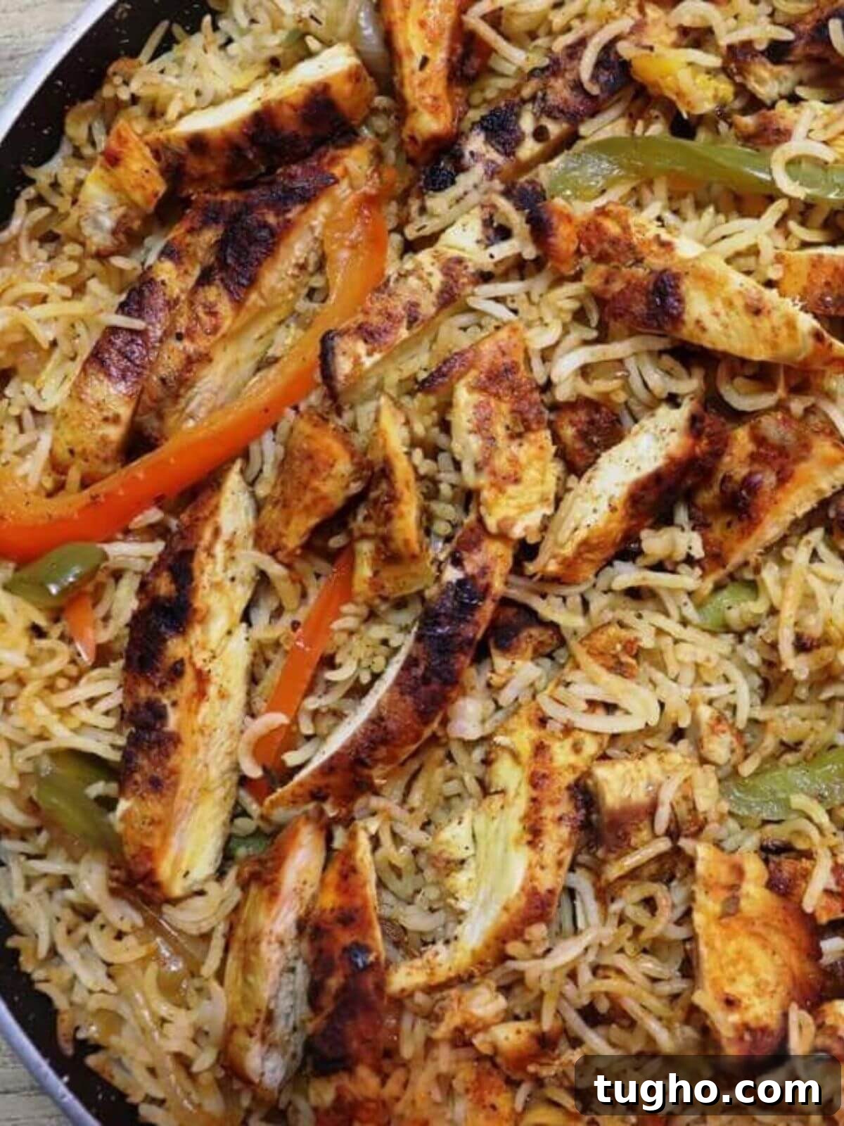 One-Pan Chicken Fajita Rice Skillet Recipe 2 close-up of chicken fajita rice in a pan.