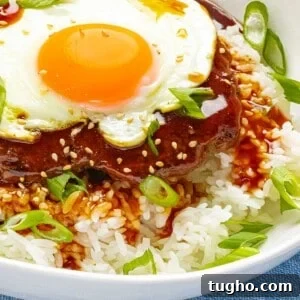 Loco Moco Recipe: Hawaiian Burger with Savory Brown Gravy 14 Loco moco made with a juicy beef burger patty on top of rice with brown gravy and a sunny side up egg.
