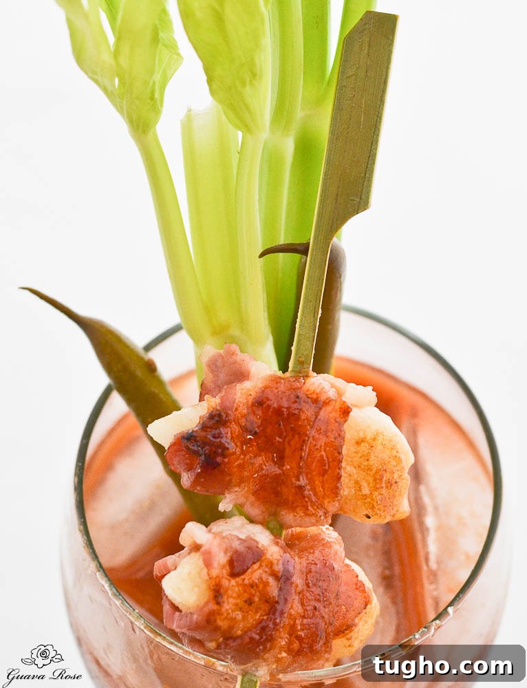 Crispy Pan-Fried Bacon-Wrapped Mochi Recipe 8 Bacon wrapped mochi over Bloody Mary, long view