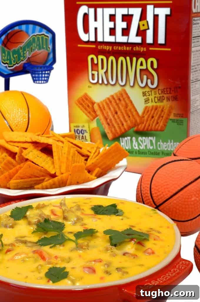 Cheez-It Hot and Spicy Grooves with Tango Sausage Cheese Dip 2 a bowl of cheez-it dip