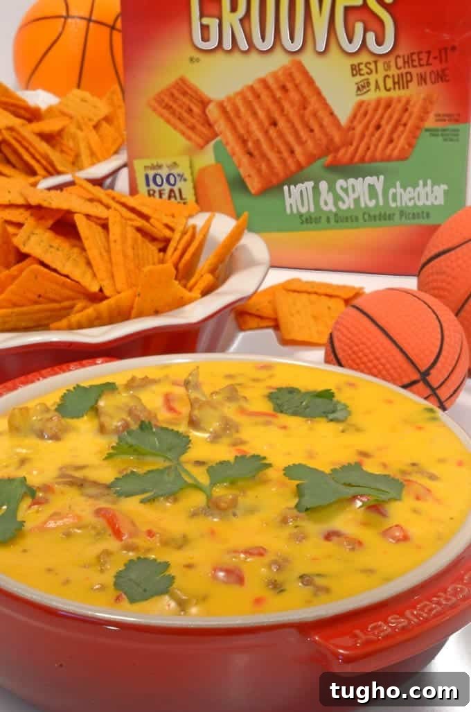 Cheez-It Hot and Spicy Grooves with Tango Sausage Cheese Dip 5 A bowl of cheese dip