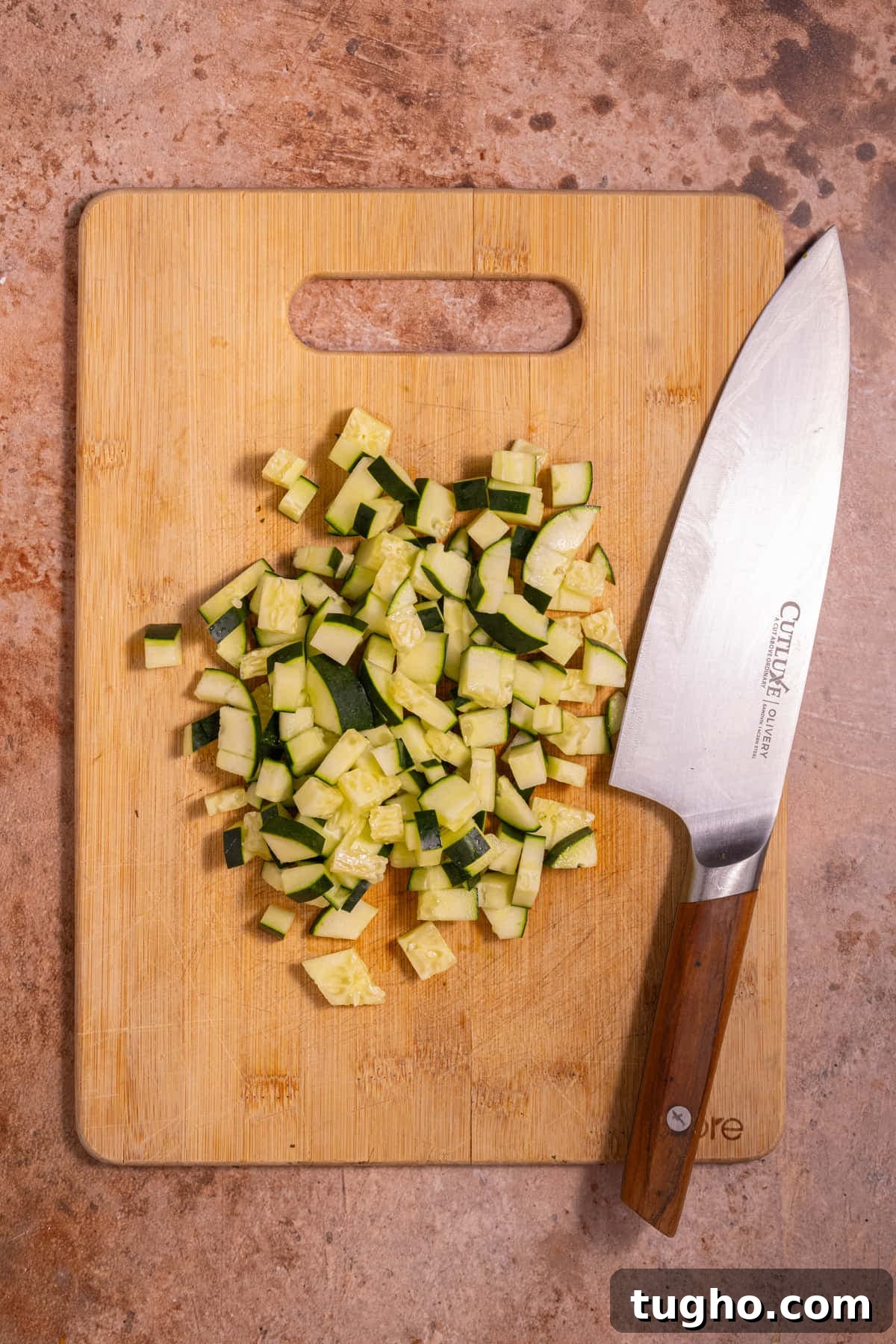 Vegan Lemon Pearl Couscous Salad 6 Diced cucumbers on a chopping board