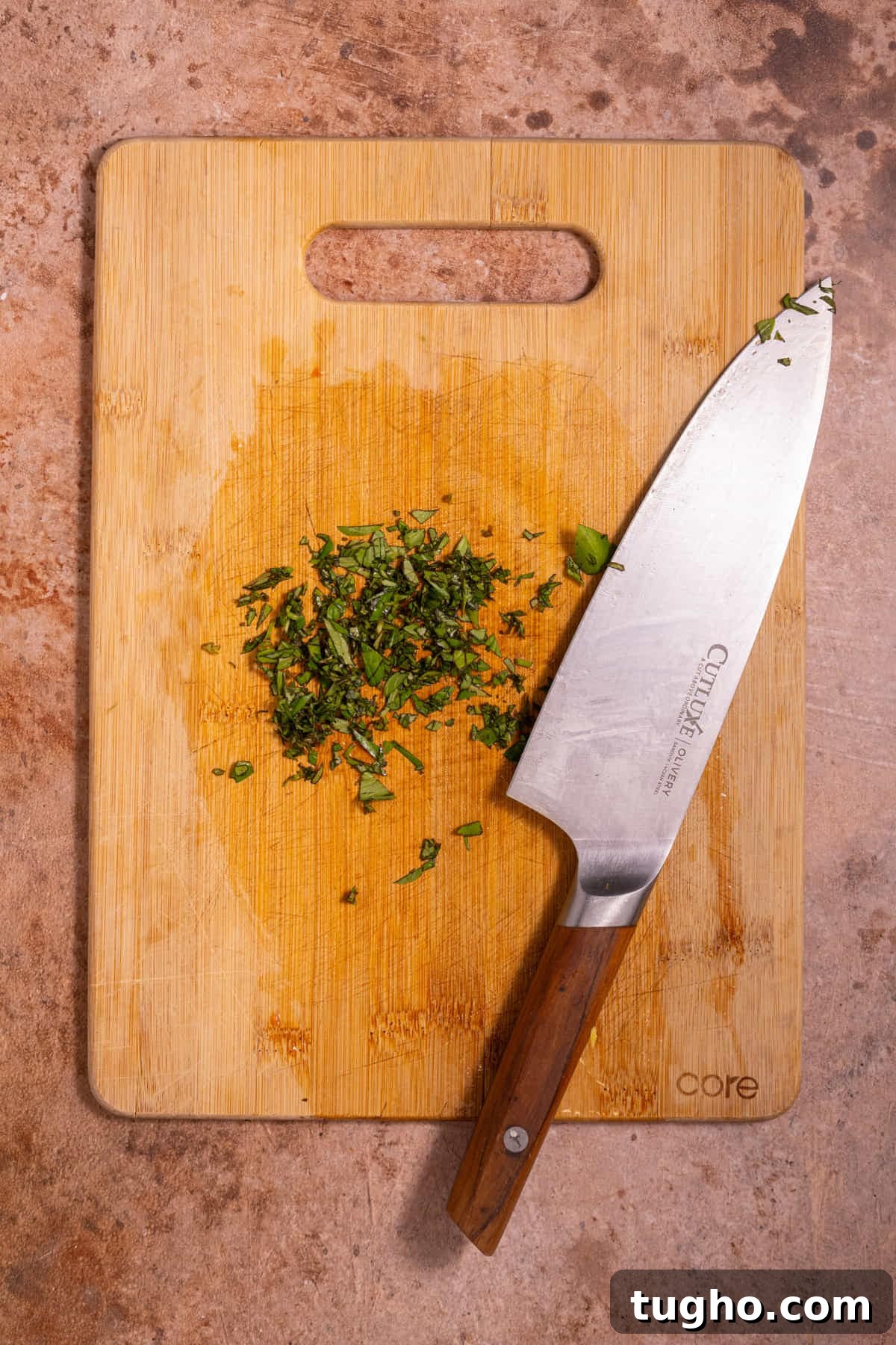 Vegan Lemon Pearl Couscous Salad 7 Diced fresh basil leaves on a chopping board